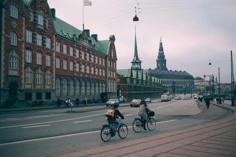 Copenhagen: Guided Bike Tour in French - Where the tour starts: Axelborg Visitor Service, Tivoli, and Vesterbrogade